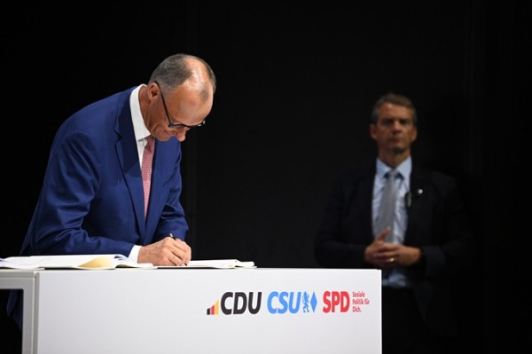 Merz pledges to turn German fortunes around as coalition deal signed Merz pledges to turn German fortunes around as coalition deal signed