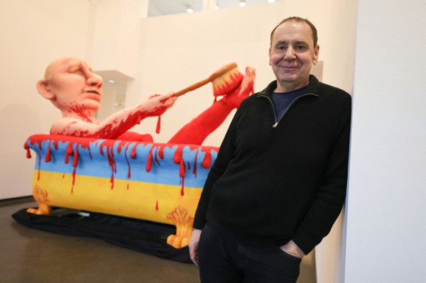 Russia sets trial date for German artist over satirical Putin floats Russia sets trial date for German artist over satirical Putin floats