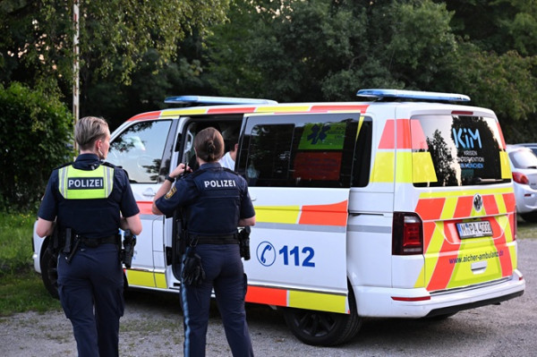 Teen on trial for killing officer during robbery in Germany Teen on trial for killing officer during robbery in Germany